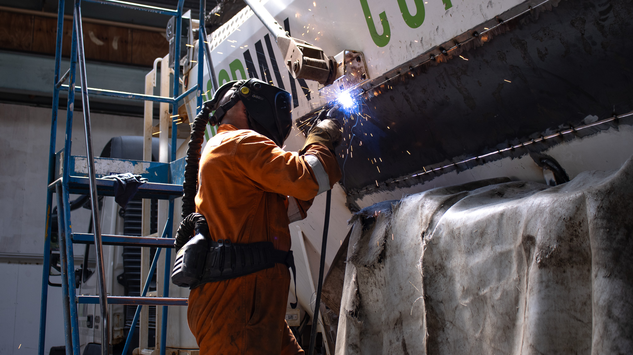 Armcon engineer servicing and welding concrete equipment
